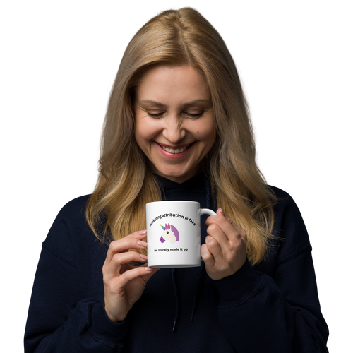 woman holding Marketing Attribution Is Fake News Mug in left hand